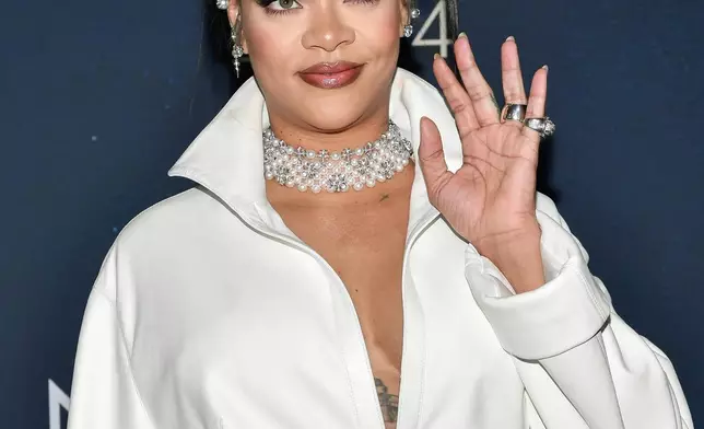 FILE - Rihanna attends the 38th annual Footwear News Achievement Awards at Cipriani South Street on Wednesday, Dec. 4, 2024, in New York. (Photo by Evan Agostini/Invision/AP, File)
