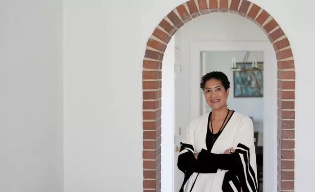 Jessie Schutt-Aine, the executive director of the Clara Lionel Foundation, poses for a portrait, Tuesday, March 4, 2025, in Kensington, Md. (AP Photo/Julia Demaree Nikhinson)