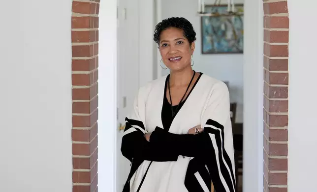 Jessie Schutt-Aine, the executive director of the Clara Lionel Foundation, poses for a portrait, Tuesday, March 4, 2025, in Kensington, Md. (AP Photo/Julia Demaree Nikhinson)
