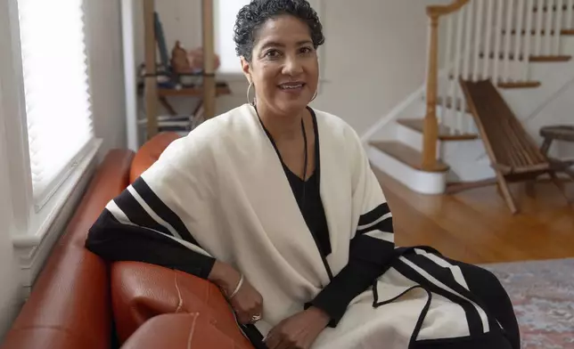 Jessie Schutt-Aine, the executive director of the Clara Lionel Foundation, poses for a portrait, Tuesday, March 4, 2025, in Kensington, Md. (AP Photo/Julia Demaree Nikhinson)