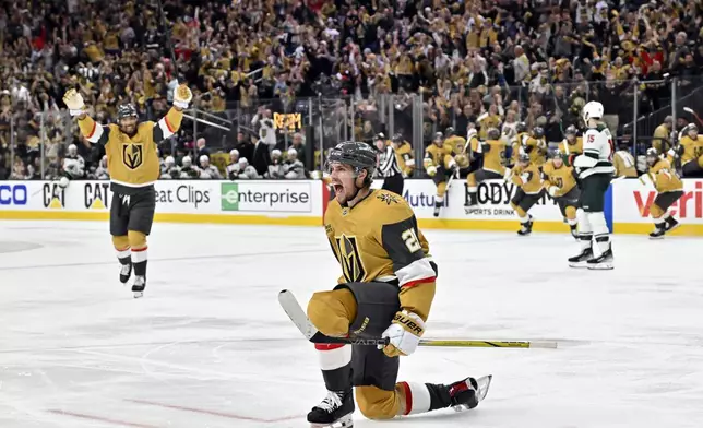 Vegas Golden Knights center Brett Howden (21) reacts after scoring the winning goal against the Minnesota Wild during overtime of Game 5 of a first-round NHL hockey playoff series against the Minnesota Wild, Tuesday, April 29, 2025, in Las Vegas. (AP Photo/David Becker)