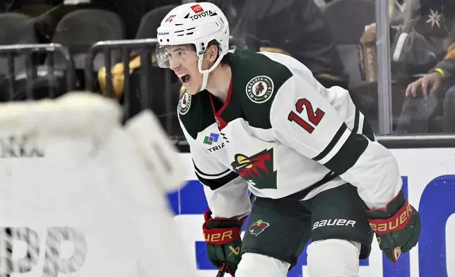 Minnesota Wild left wing Matt Boldy (12) reacts after scoring against the Vegas Golden Knights during the third period of Game 5 of a first-round NHL hockey playoff series Tuesday, April 29, 2025, in Las Vegas. (AP Photo/David Becker)