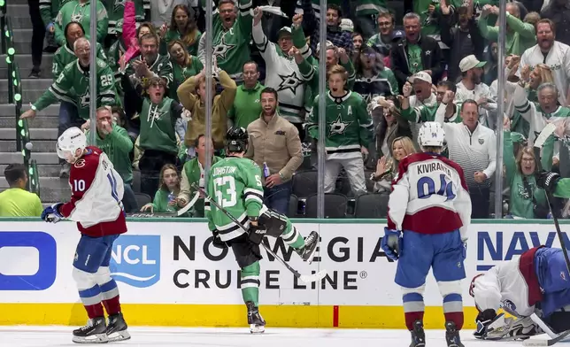 Dallas Stars center Wyatt Johnston (53) celebrates after scoring during the second period of Game 5 of a first-round NHL hockey playoff series against the Colorado Avalanche in Dallas, Monday, April 28, 2025. (AP Photo/Gareth Patterson)