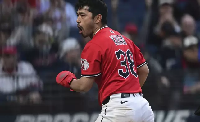 Cleveland Guardians' Steven Kwan celebrates after scoring a run on a pass ball by New York Yankees relief pitcher Mark Leiter Jr. during the sixth inning of a baseball game Tuesday, April 22, 2025, in Cleveland. (AP Photo/David Dermer)