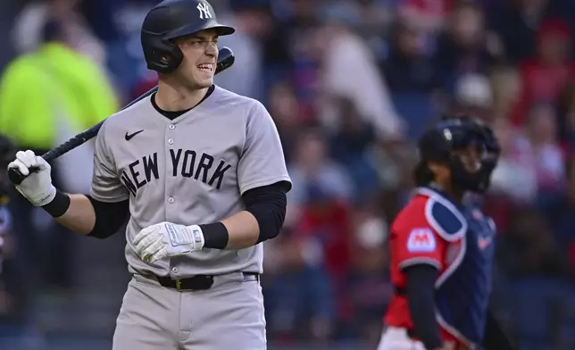 New York Yankees' Ben Rice walks to the dugout after striking out during the third inning of a baseball game against the Cleveland Guardians Tuesday, April 22, 2025, in Cleveland. (AP Photo/David Dermer)