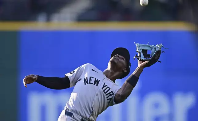 New York Yankees second baseman Jazz Chisholm Jr. catches a ball hit by Cleveland Guardians' Kyle Manzardo during the fourth inning of a baseball game Tuesday, April 22, 2025, in Cleveland. (AP Photo/David Dermer)