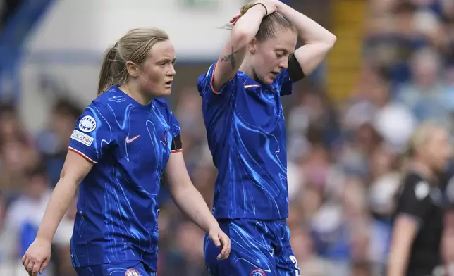 Chelsea's Erin Cuthbert and Keira Walsh, right, react after Barcelona's Ewa Pajor scored her side's second goal during the women's Champions League semifinals, second leg, soccer match between Chelsea FC and FC Barcelona at Stamford Bridge in London, Sunday, April 27, 2025. (AP Photo/Dave Shopland)