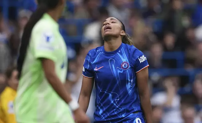Chelsea's Catarina Macario reacts after a missed chance to score during the women's Champions League semifinals, second leg, soccer match between Chelsea FC and FC Barcelona at Stamford Bridge in London, Sunday, April 27, 2025. (AP Photo/Dave Shopland)