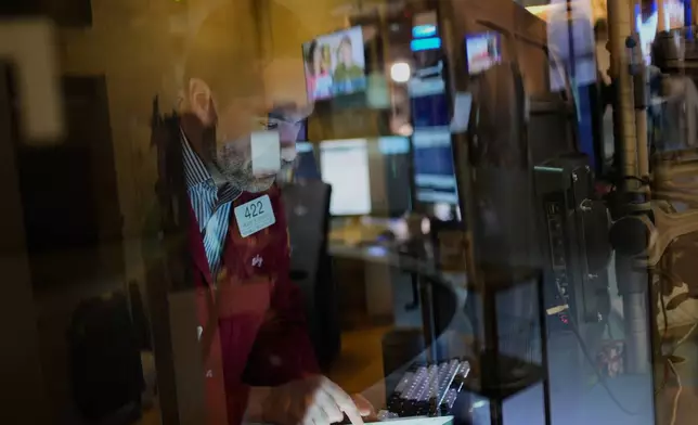 Traders work on the floor at the New York Stock Exchange in New York, Wednesday, April 9, 2025. (AP Photo/Seth Wenig)
