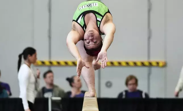 Raiden Hung, of Jurassic Gymnastics in Boston, competes on the balance beam at the 2025 NAIGC national competition in Pittsburgh, Friday, April 4, 2025. (AP Photo/Gene J. Puskar)