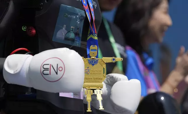 The medal for the second runner up is seen during a ceremony for the Humanoid Robot Half-Marathon held in Beijing on Saturday, April 19, 2025. (AP Photo/Ng Han Guan)