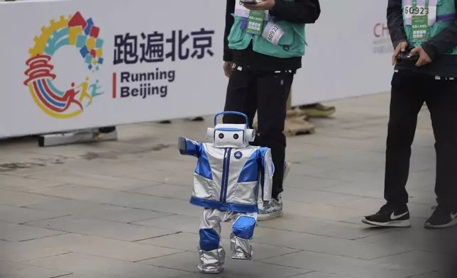 A robot takes part in what is billed as the world's first robot half marathon during the Humanoid Robot Half-Marathon held in Beijing on Saturday, April 19, 2025. (AP Photo/Ng Han Guan)