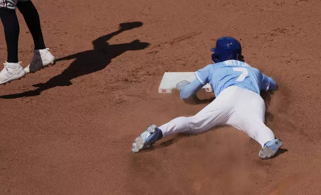 Kansas City Royals' Bobby Witt Jr. steals second during the sixth inning of a baseball game against the Minnesota Twins, Thursday, April 10, 2025, in Kansas City, Mo. (AP Photo/Charlie Riedel)