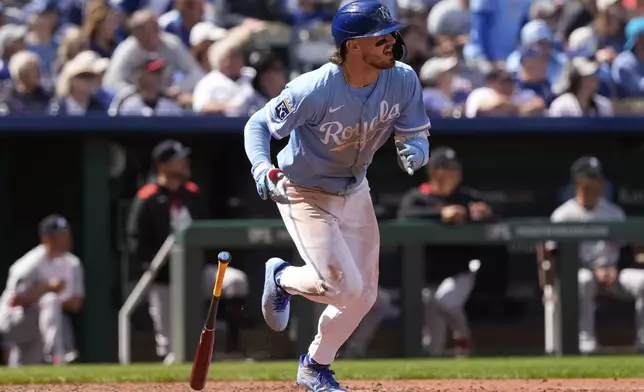 Kansas City Royals' Bobby Witt Jr. watches his sacrifice fly to score one run during the seventh inning of a baseball game against the Minnesota Twins, Thursday, April 10, 2025, in Kansas City, Mo. (AP Photo/Charlie Riedel)