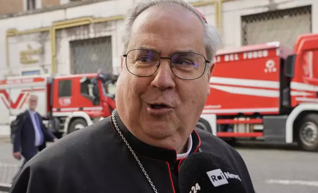Argentine Cardinal Ángel Sixto Rossi speaks to reporters as he arrives for a college of cardinals' meeting, at the Vatican, Monday, April 28, 2025. (AP Photo/Gregorio Borgia)