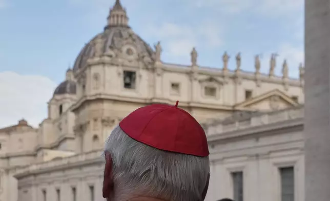 St Peter's Basilica is seen in the background as a cardinal arrives for a college of cardinals' meeting, at the Vatican, Monday, April 28, 2025. (AP Photo/Gregorio Borgia)