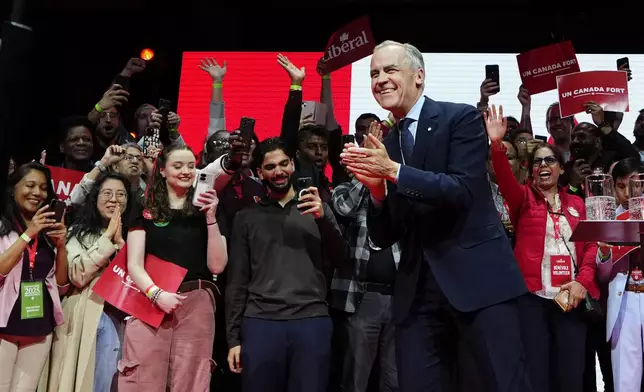 Canadian Prime Minister Mark Carney arrives on stage at his campaign headquarters after the Liberal Party won the Canadian election in Ottawa on Tuesday, April 29, 2025. (Justin Tang/The Canadian Press via AP)