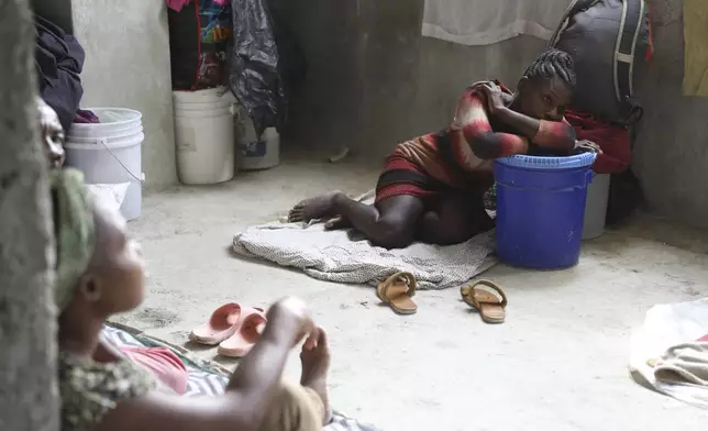 A woman rests at a shelter for families displaced by gang violence in the Petion-Ville neighborhood of Port-au-Prince, Haiti, Saturday, April 26, 2025.(AP Photo/Odelyn Joseph)