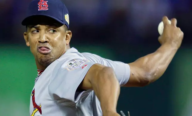 FILE - St. Louis Cardinals relief pitcher Octavio Dotel throws during the eighth inning in Game 5 of baseball's World Series against the Texas Rangers, Monday, Oct. 24, 2011, in Arlington, Texas. (AP Photo/Matt Slocum, File)