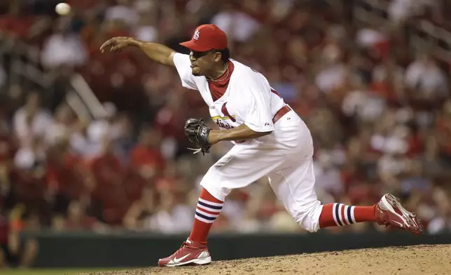 FILE - St. Louis Cardinals relief pitcher Octavio Dotel throws during the ninth inning of a baseball game against the Houston Astros Thursday, July 28, 2011, in St. Louis. (AP Photo/Jeff Roberson, File)