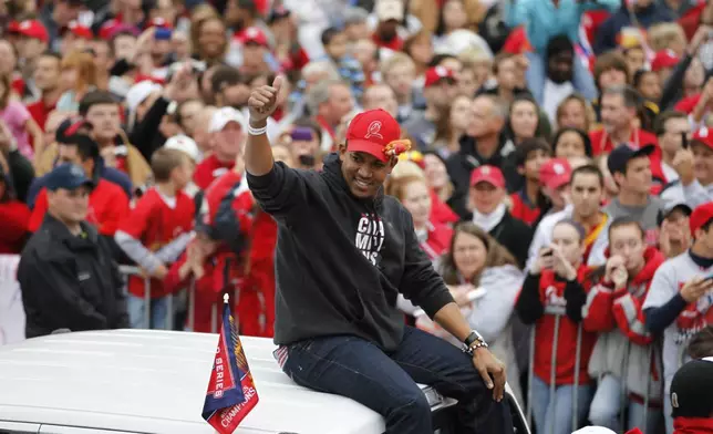FILE - St. Louis Cardinals relief pitcher Octavio Dotel participates in a victory parade after defeating the Texas Rangers to win their 11th World Series in franchise history Sunday, Oct. 30, 2011, in St. Louis. (AP Photo/Jeff Roberson, File)