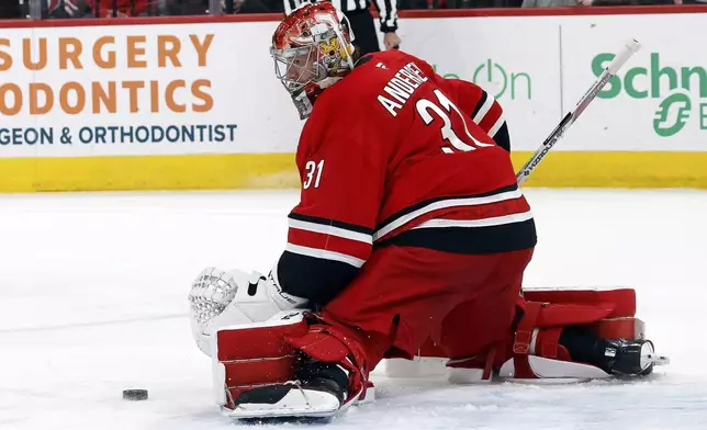 Carolina Hurricanes goaltender Frederik Andersen (31) blocks a shot from the Toronto Maple Leafs during the first period of an NHL hockey game in Raleigh, N.C., Sunday, April 13, 2025. (AP Photo/Karl DeBlaker)