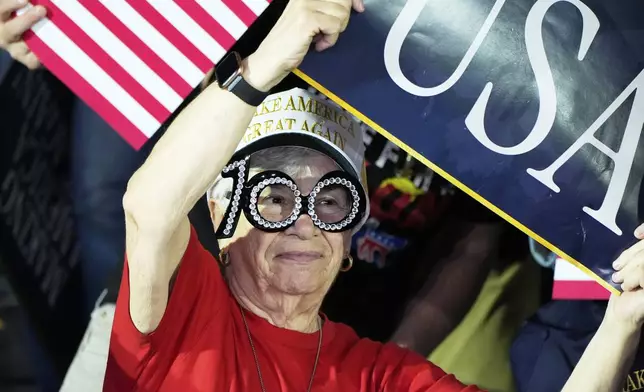 People arrive before President Donald Trump speaks on his first 100 days at Macomb County Community College Sports Expo Center, Tuesday, April 29, 2025, in Warren, Mich. (AP Photo/Alex Brandon)