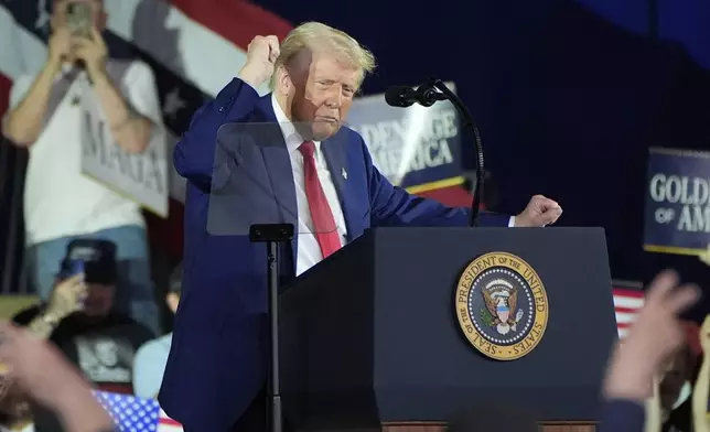 President Donald Trump dances after speaking on his first 100 days at Macomb County Community College Sports Expo Center, Tuesday, April 29, 2025, in Warren, Mich. (AP Photo/Alex Brandon)