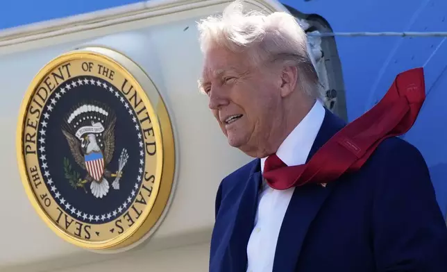 President Donald Trump arrives on Air Force One at Selfridge Air National Guard Base, Tuesday, April 29, 2025, in Harrison Township, Mich. (AP Photo/Alex Brandon)