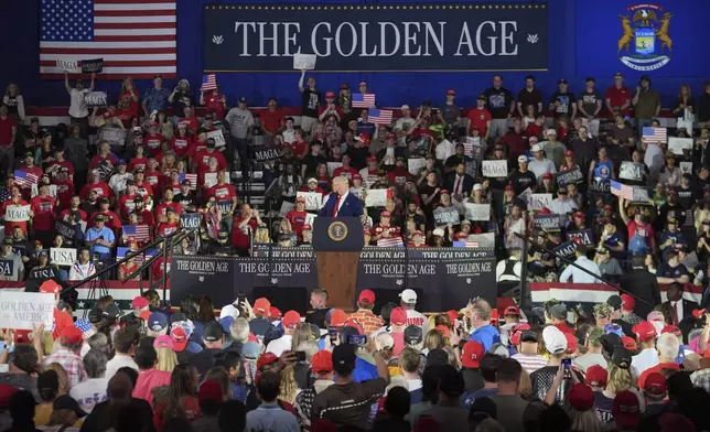 President Donald Trump speaks on his first 100 days at Macomb County Community College Sports Expo Center, Tuesday, April 29, 2025, in Warren, Mich. (AP Photo/Paul Sancya)