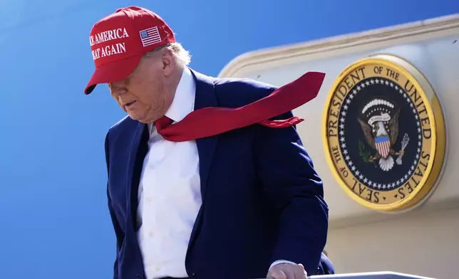President Donald Trump arrives on Air Force One at Selfridge Air National Guard Base, Tuesday, April 29, 2025, in Harrison Township, Mich. (AP Photo/Alex Brandon)