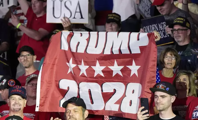 People arrive before President Donald Trump speaks on his first 100 days at Macomb County Community College Sports Expo Center, Tuesday, April 29, 2025, in Warren, Mich. (AP Photo/Alex Brandon)