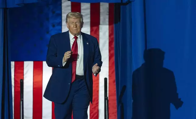 President Donald Trump arrives to speak on his first 100 days at Macomb County Community College Sports Expo Center, Tuesday, April 29, 2025, in Warren, Mich. (AP Photo/Alex Brandon)