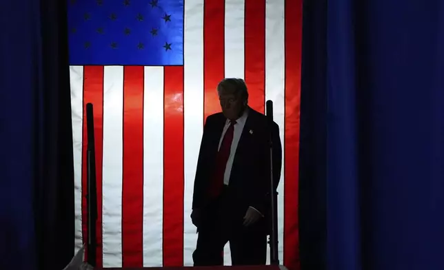 President Donald Trump arrives to speak on his first 100 days at Macomb County Community College Sports Expo Center, Tuesday, April 29, 2025, in Warren, Mich. (AP Photo/Alex Brandon)