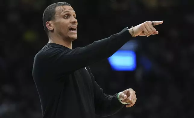 Boston Celtics head coach Joe Mazzulla calls to his players during the first half of an NBA basketball game against the Charlotte Hornets, Friday, April 11, 2025, in Boston. (AP Photo/Charles Krupa)