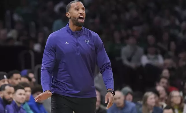 Charlotte Hornets head coach Charles Lee yells to his players during the first half of an NBA basketball game against Boston Celtics, Friday, April 11, 2025, in Boston. (AP Photo/Charles Krupa)