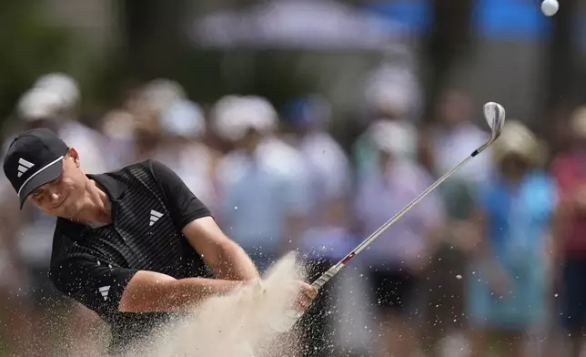 Ludvig Aberg, of Sweden, hits from a bunker on the 16th hole during the second round of the RBC Heritage golf tournament, Friday, April 18, 2025, in Hilton Head Island, S.C. (AP Photo/Mike Stewart)