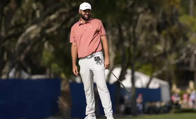 Scottie Scheffler reacts to his putt on the 17th green during the second round of the RBC Heritage golf tournament, Friday, April 18, 2025, in Hilton Head Island, S.C. (AP Photo/Mike Stewart)