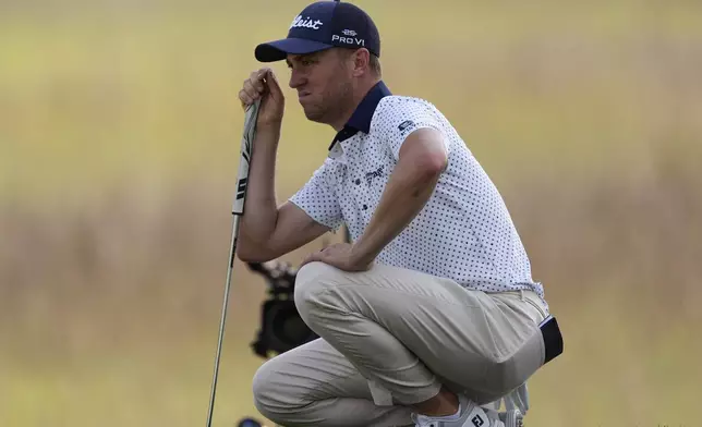 Justin Thomas lines up a putt on the 17th green during the second round of the RBC Heritage golf tournament, Friday, April 18, 2025, in Hilton Head Island, S.C. (AP Photo/Mike Stewart)