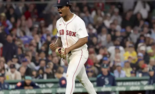 Boston Red Sox pitcher Brayan Bello reacts after striking out Seattle Mariners' Randy Arozarena leaving two runners on base during the fifth inning of a baseball game, Tuesday, April 22, 2025, in Boston. (AP Photo/Mark Stockwell)