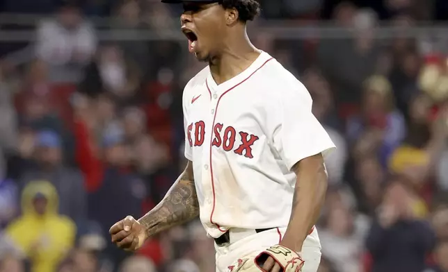 Boston Red Sox pitcher Brayan Bello reacts after striking out Seattle Mariners' Randy Arozarena leaving two runners on base during the fifth inning of a baseball game, Tuesday, April 22, 2025, in Boston. (AP Photo/Mark Stockwell)