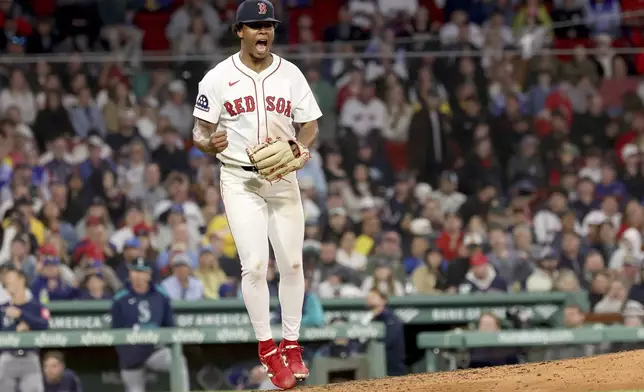 Boston Red Sox pitcher Brayan Bello reacts after striking out Seattle Mariners' Randy Arozarena leaving two runners on base during the fifth inning of a baseball game, Tuesday, April 22, 2025, in Boston. (AP Photo/Mark Stockwell)