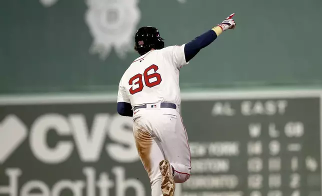 Boston Red Sox's Triston Casas gestures as he rounds the bases after hitting a three-run home run during the seventh inning of a baseball game against the Seattle Mariners, Tuesday, April 22, 2025, in Boston. (AP Photo/Mark Stockwell)