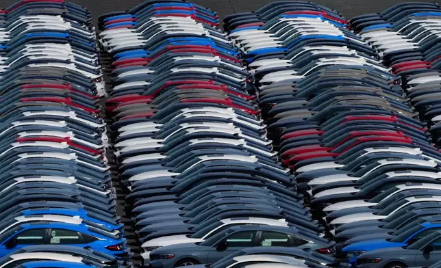 Export vehicles are parked at Daikoku Pier in Yokohama, near Tokyo, Tuesday, April 8, 2025. (AP Photo/Hiro Komae)