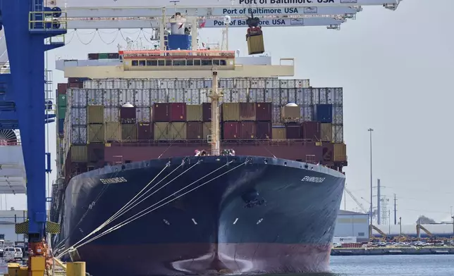 A crane lifts an imports container from the cargo ship Epaminondas while it is docked at the Port of Baltimore, Wednesday, April 9, 2025, in Baltimore. (AP Photo/Stephanie Scarbrough)