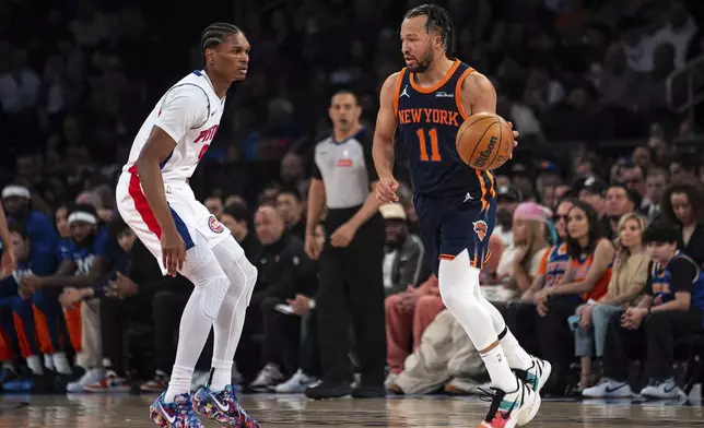 New York Knicks guard Jalen Brunson (11) looks for an opening against the Detroit Pistons during the first half of Game 2 of an NBA basketball first-round playoff series, Monday, April 21, 2025, in New York. (AP Photo/Angelina Katsanis)