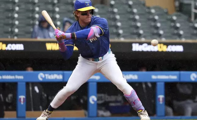 Minnesota Twins' Harrison Bader bats against the Chicago White Sox during the seventh inning of a baseball game Thursday, April 24, 2025, in Minneapolis, Minn. (AP Photo/Ellen Schmidt)