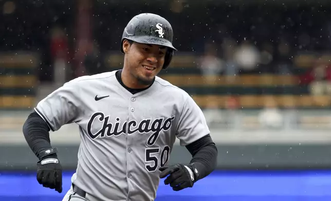 Chicago White Sox's Lenyn Sosa (50) rounds the bases after hitting a home run during the second inning of a baseball game against the Minnesota Twins, Thursday, April 24, 2025, in Minneapolis, Minn. (AP Photo/Ellen Schmidt)