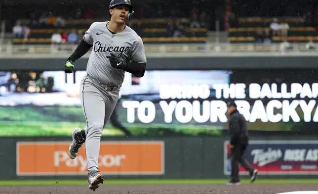 Chicago White Sox's Miguel Vargas (20) rounds the bases after hitting a home run during the sixth inning of a baseball game against the Minnesota Twins, Thursday, April 24, 2025, in Minneapolis, Minn. (AP Photo/Ellen Schmidt)