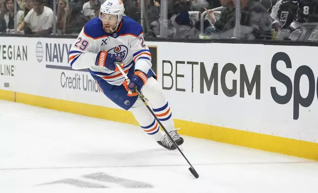 Edmonton Oilers center Leon Draisaitl moves the puck during the first period in Game 2 of an NHL hockey first-round playoff series against the Los Angeles Kings, Wednesday, April 23, 2025, in Los Angeles. (AP Photo/Mark J. Terrill)